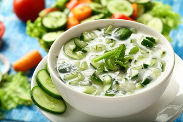 Homemade delicious raitha, salad with cucumber, yogurt and herbs.