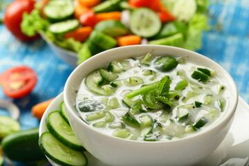 Homemade delicious raitha, salad with cucumber, yogurt and herbs.