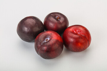Ripe sweet plum fruit heap