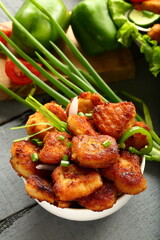 Delicious fish nuggets served with green salads. seafood recipes background.