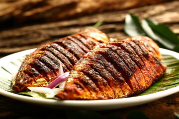 Homemade delicious Kerala fish fry, fried with exotic Indian spices.