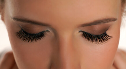 Woman with beautiful eyelashes after extension procedure