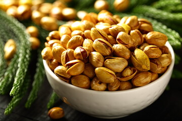 Healthy vegan diet snack foods- roasted and salted organic pistachios. 