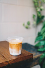 dirty coffee in takeaway glass