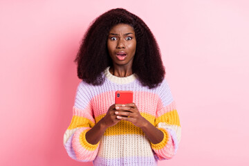 Portrait of impressed dark skin blogger open mouth staring camera bad comment isolated on pink...