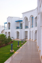 An empty hotel in Egypt, part of a beautiful, cozy Turkish hotel with a lawn and white hulls