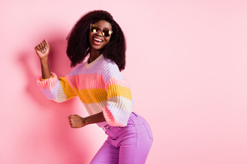 Profile side photo of young black girl happy positive smile have fun dance isolated over pink color...