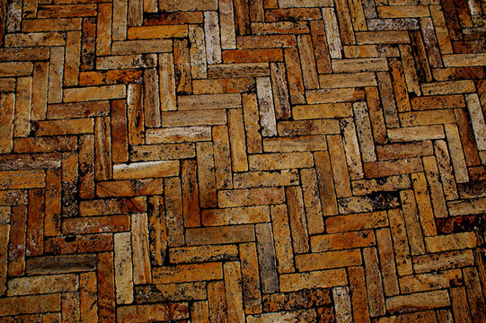 terracotta floor tiles, regularly arranged in a chevron pattern