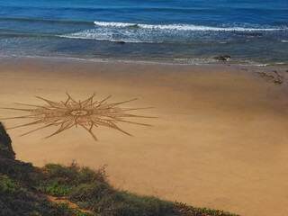 Beautiful beach mandala with a flower in Albufeira in Portugal