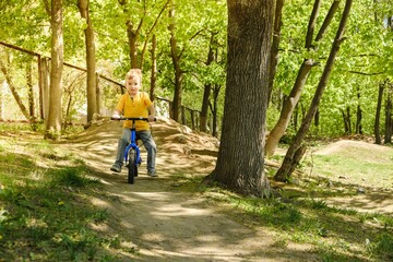 Fototapeta premium bike child summer bicycle kid. first.