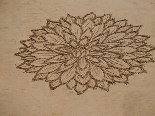 Beautiful beach mandala with a flower in Albufeira in Portugal