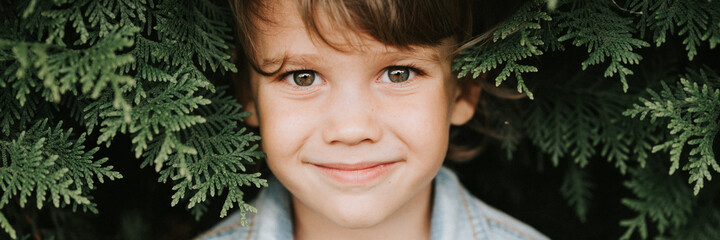 portrait of the face of a cute little happy caucasian candid healthy five year old kid boy...