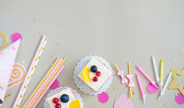 Birthday attributes: birthday cake pieces, candles, photo shoot accessories