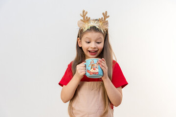 The girl really likes New Year's hot chocolate.