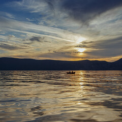 Fototapeta na wymiar Boat at sunset in the Adriatic sea