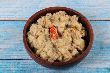 bowl of poppy seeds curry with poptato