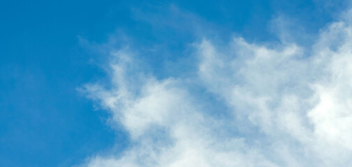 Blue sky background with white clouds. Panorama
