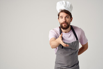 man in a chef's cap apron work as a cook restaurant kitchen