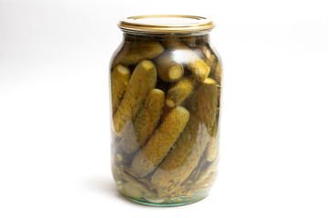 Pickled cucumbers in a jar. Canned vegetables