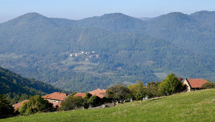A typical traditional landscape of the Val Borbera with a small rural village in the hills