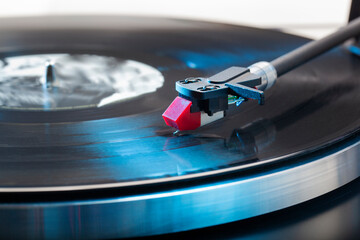 Close-up of a vintage turntable with the needle on a lp