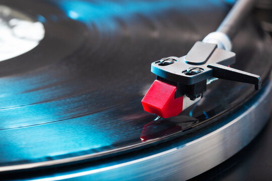 Close-up of a vintage turntable with the needle on a lp