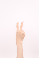 hand showing number two In front of the white background