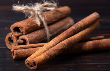 cinnamon sticks on wood background, spice close up