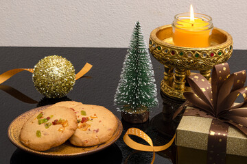 Christmas decorations with a plate of orange peel cookies.