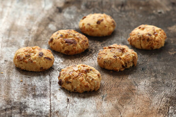 Chocolate cookies on wooden table.