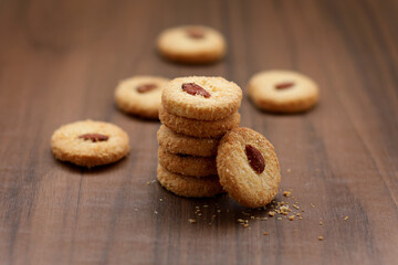Chocolate cookies on wooden table.