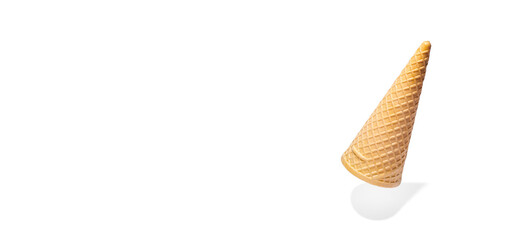 Empty waffle cone hanging in the air isolated on white background