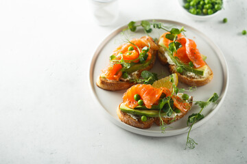 Homemade salmon bruschetta with green pea