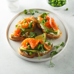 Homemade salmon bruschetta with green pea