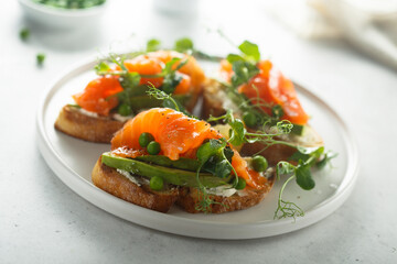 Homemade salmon bruschetta with green pea