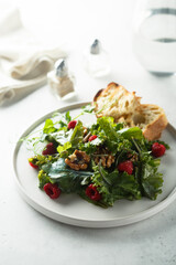 Healthy green salad with raspberry and walnut
