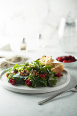 Healthy green salad with raspberry and walnut