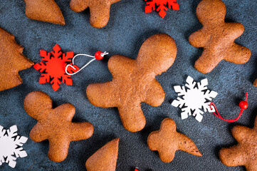 Homemade gingerbread cookies on dark background. Christmas composition, new year background. Number 2022 with cookies. Christmas dessert. New Year flatlay.