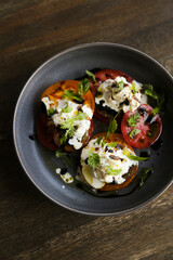 Tomatoes with fresh cheese and balsamic