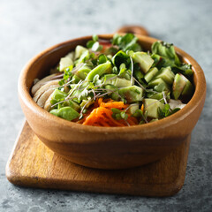 Healthy Buddha bowl with chicken and avocado