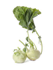 Whole ripe kohlrabies with leaves on white background