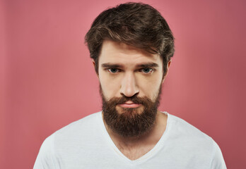 Fototapeta premium emotional man in a white t-shirt hand gestures anger close-up