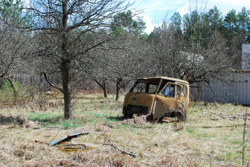 Urbex, vehicle cemetery in Prypiat, metal car side view, cabine, Chernobyl Nuclear Power Plant...