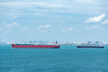 Cargo ships sailing near port of Singapore.