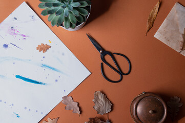 Seasonal autumn fall work creative background with scissors occult objects and crystal