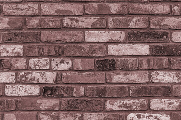 Background of brown weathered old brick wall