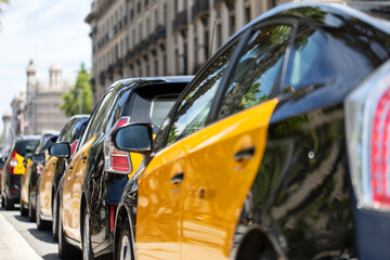 Group of taxi cabs in Barcelona - obrazy, fototapety, plakaty