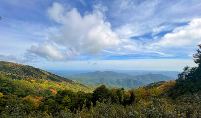 Fototapeta na wymiar A beautiful fall day is seen from an overlook along the Blue Ridge Parkway in North Carolina.