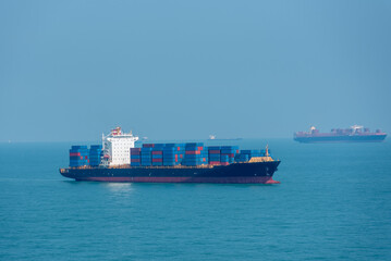 Container ship sailing through the sea. 