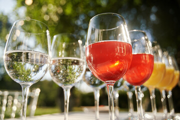 Table set for an event party or wedding reception. Banquet table design. Festive glasses with champagne and white wine.